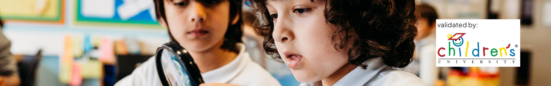 Two primary school children explore a science activity with a magnifying glass. A 'validated by Children's University' logo is displayed