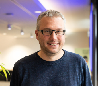 Headshot of Tom Holloway, Director of Regional Programme, taken 2024