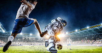 Astronaut slide tackling a footballer