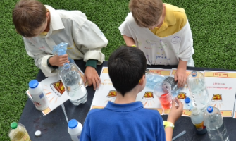 pupils conducting a science experience outdoors